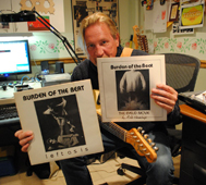 Arlo Hennings holding the Burden of the Beat record sleeves